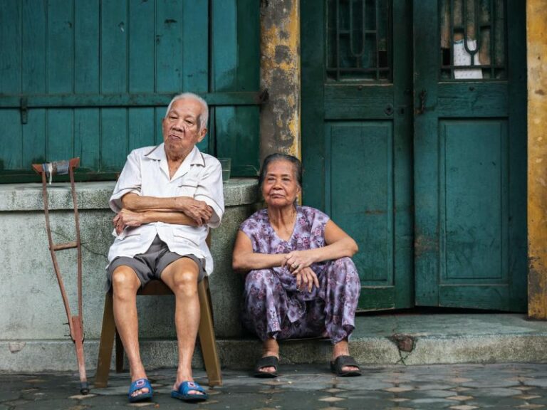 800 - Enchanting Sapa - grandparents-are-sitting-near-the-front-door-of-their-house-hanoi-vietnam