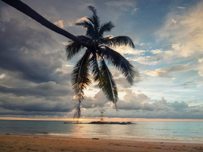 800 - Khao Lak - lighthouse-beacon-tower-and-coconut-tree-on-nang-thong-beach-at-sunset-in-khao-lak-in-phang-nga-thailand-seascape-at-famous-travel-destination