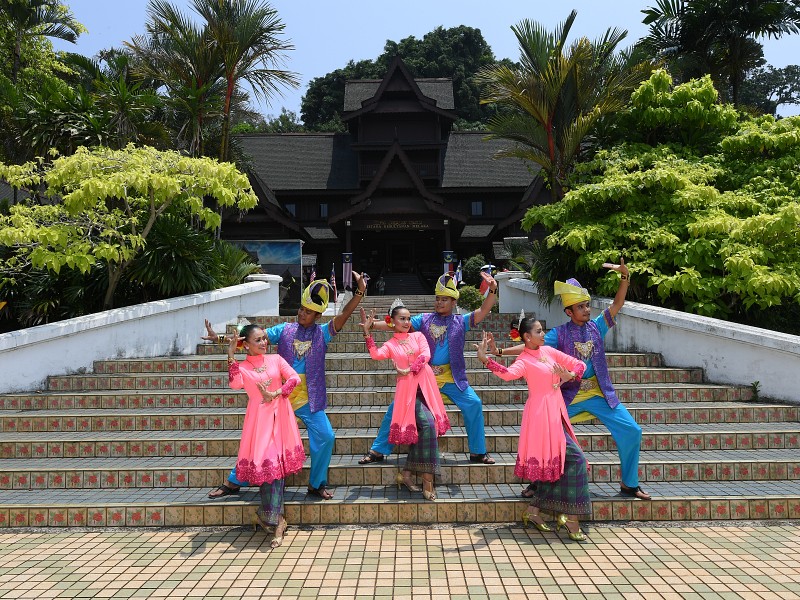 A group of dancer perform a traditional Malay dance in front of Malacca Sultanate Palace Museum