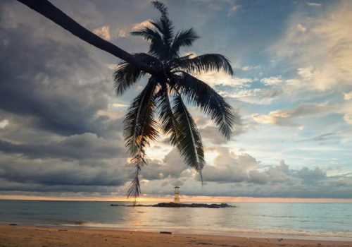 800 - Khao Lak - lighthouse-beacon-tower-and-coconut-tree-on-nang-thong-beach-at-sunset-in-khao-lak-in-phang-nga-thailand-seascape-at-famous-travel-destination