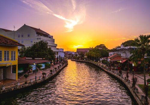 Canal and the old town in melaka, or malacca, Malaysia at dusk