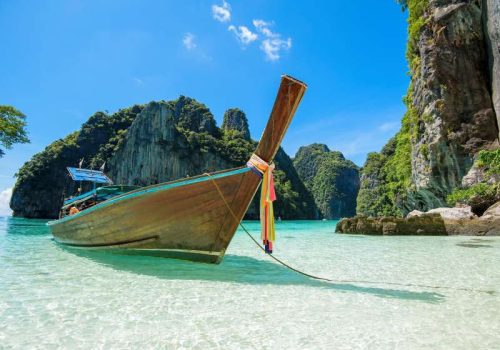 View of thai traditional longtail Boat over clear sea and sky in the sunny day, Phi phi Islands, Thailand